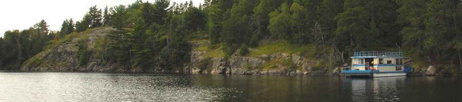 Houseboat moored near Martin Island bimage116150 keywords: lake,boat,animal,people,cabin